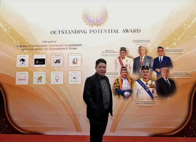 Jay Teh in front of the Outstanding Potential Award backdrop