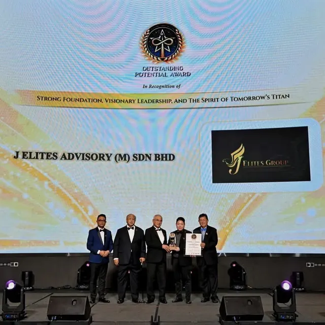J Elites Advisory (M) Sdn Bhd receiving the Outstanding Potential Award on stage