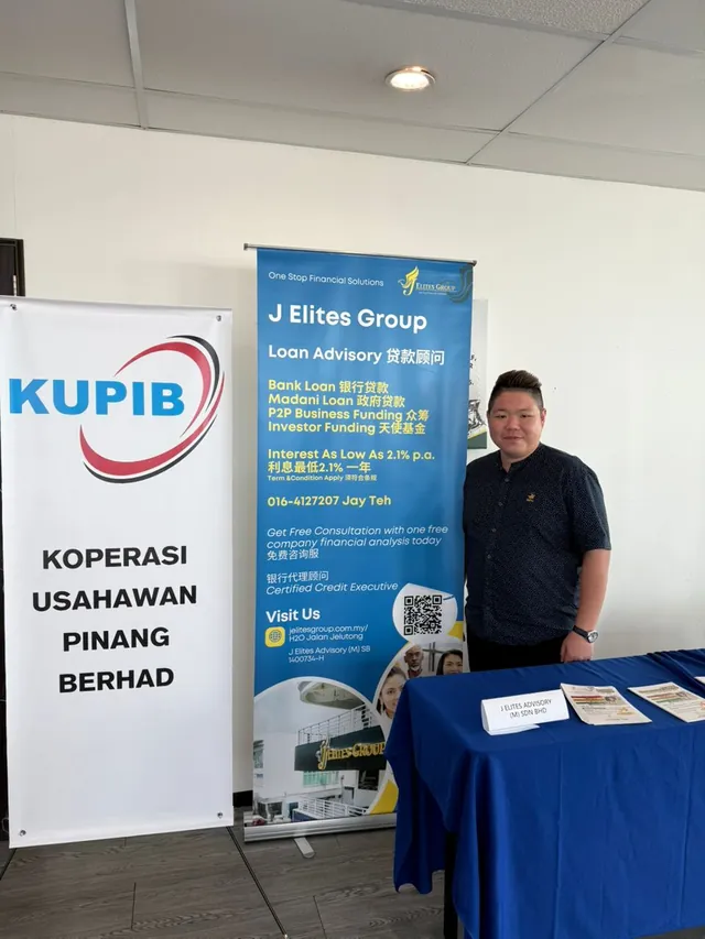Jay Teh at the J Elites Group booth, beside Koperasi Usahawan Pinang Berhad (KUPIB)